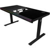 Dual-motor sit/stand adjustable-height gaming desk with built-in PC case, wireless charger, RGB lighting, control panel, and USB